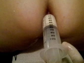 2 Warm milk enema syringes and anal inspection